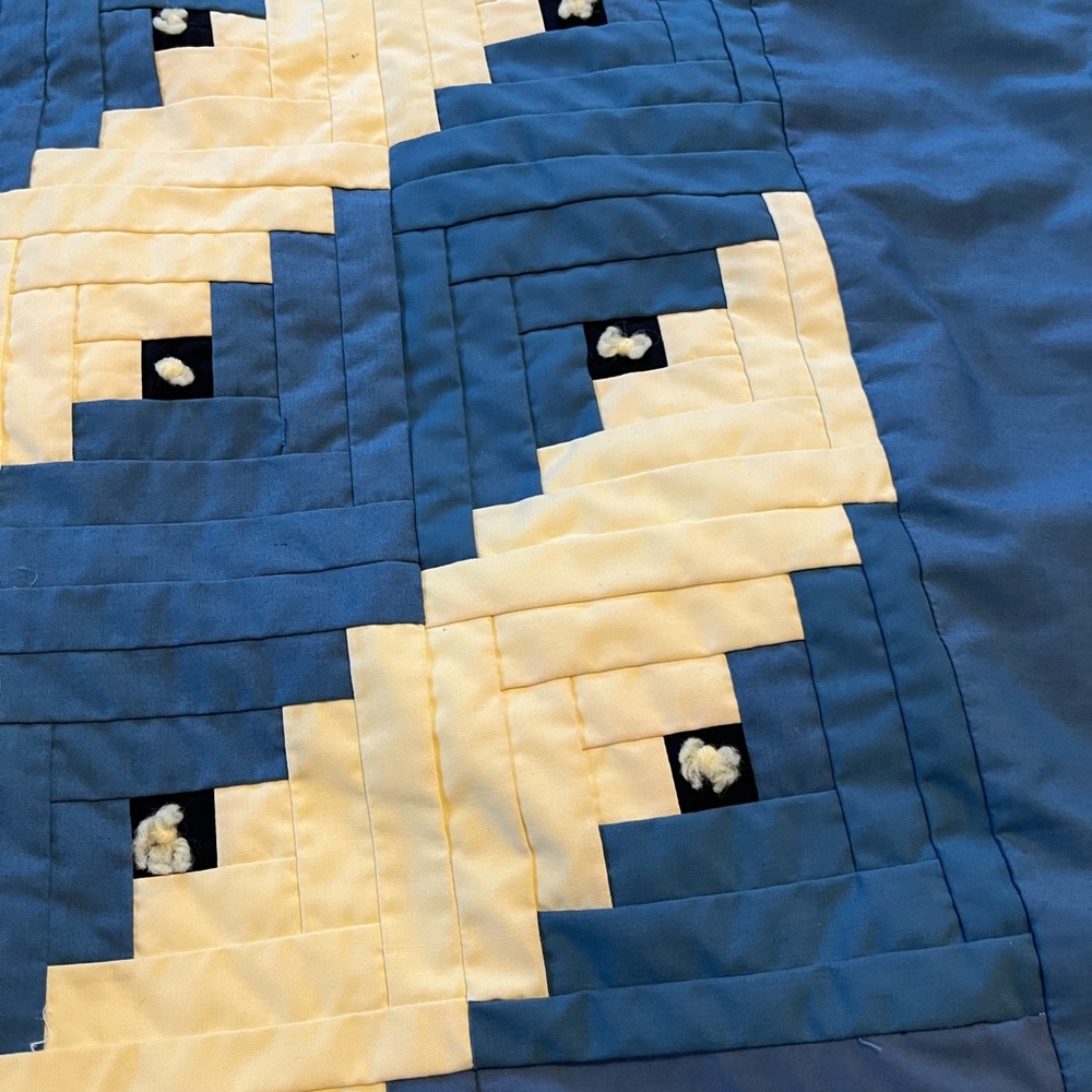 Handmade tied quilt , blue and yellow with blue backed fabric.